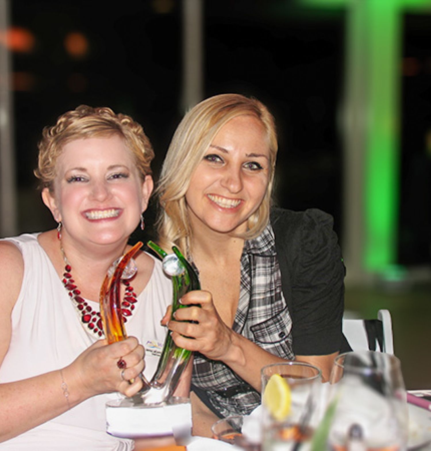 HARC CEO, Jenna LeComte-Hinely and Director of Research, Casey Leier, holding an award